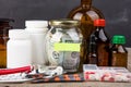 Saving money for health care insurance - money glass, stethoscope, pills and bottles Royalty Free Stock Photo