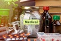 Saving money for health care insurance - money glass, stethoscope, pills and bottles Royalty Free Stock Photo
