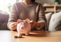 Saving money for house and real estate. Woman hand protecting on stack coins and house model on table. AI Generated Royalty Free Stock Photo