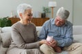 Saving money investment for future. Senior adult mature couple holding piggy bank with money coin. Old man woman Royalty Free Stock Photo