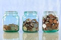 Saving money in old jars Royalty Free Stock Photo