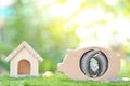 Saving money for prepare in future and new house concept, Piggy bank wood with model house on natural green background Royalty Free Stock Photo
