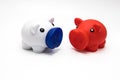 Saving money for a rainy day. Piggy banks on a white background. Savings and investments