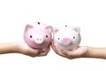 Two kids holding piggy banks Royalty Free Stock Photo
