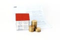 Saving plan concept with paper house and coins stack