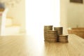 Saving stack coins money concept on desktop desk in hipster office,copy space.selective focus,vintage color. Royalty Free Stock Photo