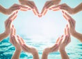 Saving water and world water day for csr campaign concept with collaborative hands in love heart shape Royalty Free Stock Photo