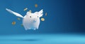 Savings concept design of piggy bank with wings flying and gold coins on blue background 3D render Royalty Free Stock Photo