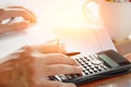 Savings, finances, economy and home concept - close up of man with calculator counting making notes at home Royalty Free Stock Photo