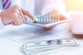 Savings, finances, economy and home concept - close up of man with calculator counting money Royalty Free Stock Photo