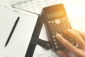 Savings, finances, economy and office concept - close up of man with calculator counting making notes. Royalty Free Stock Photo