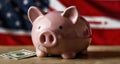 Savings piggy bank with American flag backdrop Royalty Free Stock Photo