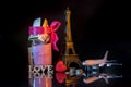 Savings for travelling with toy eiffel tower on dark background Royalty Free Stock Photo