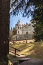 Savoia Castle framed by leaves, in Gressoney