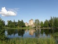 Savonlinna castle and its reflection in the lake