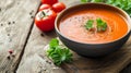 Savor the Delight: Tempting Tomato Cream Soup on Rustic Wooden Table