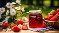 Summer Harvest Delight: Glass of Homemade Strawberry Jam Outdoors