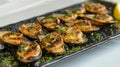 Savor the taste exquisite grilled mediterranean mussels elegantly presented on a sleek black plate