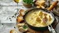 Savoring Delicious Fondue Cheese Paired with Fresh Bread and White Wine Royalty Free Stock Photo