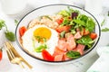 Savory breakfast with oatmeal, salmon and salad.