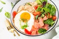 Savory breakfast with oatmeal, salmon and salad.