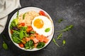 Savory breakfast with oatmeal, salmon and salad.