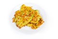 Savory cabbage pancakes on dish on a white background