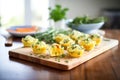 savory cheese muffins with herbs on a wooden board