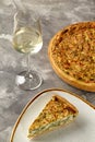 Savory cheese and spinach Quiche Lorraine with white wine Royalty Free Stock Photo