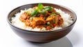 Savory Chicken Curry over Fluffy White Rice in Brown Bowl on White Table Royalty Free Stock Photo