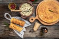 Savory crepe rolls, stuffed pancakes with ground meat filling. Traditional Russian Maslenitsa festival meal on wooden background