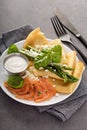Savory crepes with salmon, sour cream and asparagus