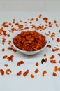 Savory and crunchy spicy macaroni in a bowl on a white background.