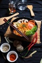 savory and delicious noodle soup with black bowl and chopsticks Royalty Free Stock Photo