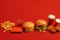 Savory delights burger and nuggets showcased on a bold red