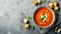Savory Delights: Decadent Tomato Soup Garnished with Mozzarella and Croutons, Set Against a Stylish