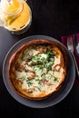 Savory dutch baby pancake with egg, bacon, traditional Dutch breakfast top view, flat lay