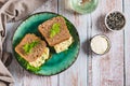Savory egg salad sandwich with avocado on whole grain bread on a plate top view Royalty Free Stock Photo