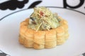 Savory filled pastry case or vol-au-vent on dinner plate Royalty Free Stock Photo