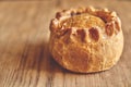 Savory Meat Pie on Wooden Surface with Copy Space