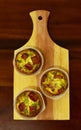 Savory mini quiches tarts on a wooden board. Baked homemade flaky dough pies. Ready for eat. Copy space Royalty Free Stock Photo