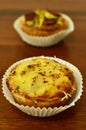 Savory mini quiches tarts on a wooden board. Baked homemade flaky dough pies. Ready for eat. Copy space Royalty Free Stock Photo