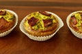 Savory mini quiches tarts on a wooden board. Baked homemade flaky dough pies. Ready for eat. Copy space Royalty Free Stock Photo