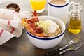 Savory oatmeal porridge with egg and bacon Royalty Free Stock Photo