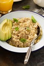 Savory oatmeal porridge with olive oil and avocado