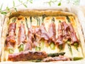 Savory pie with asparagus, prosciutto and marjoram