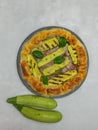 savory pie with courgettes and basil on a round plate, italian plate