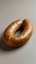 Savory ring sausage glistening under studio lights perfect for culinary projects Royalty Free Stock Photo