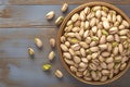 Savory roasted pistachios displayed attractively on textured wood backdrop Royalty Free Stock Photo