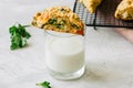 Savory scones with feta mozarella and green herbs on a glass of